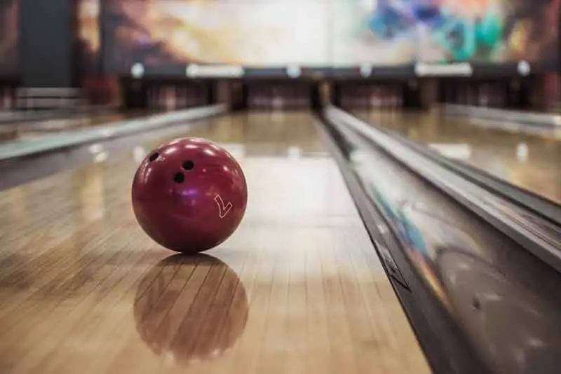 Shiny bowling ball on lane