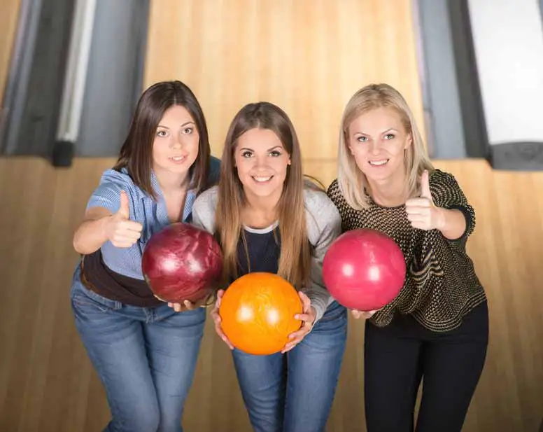 Three ladies at the bowling alley
