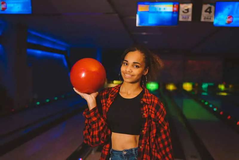 Lady holding a bowling ball