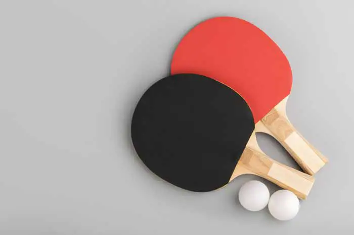 Two table tennis paddles on table