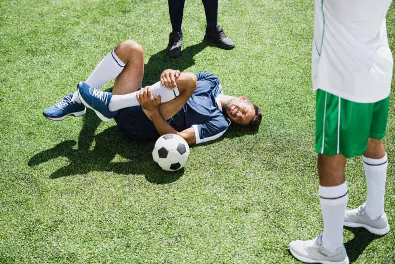 Soccer player faking injury