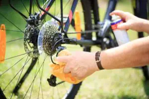 Man cleaning mountain bike after wash